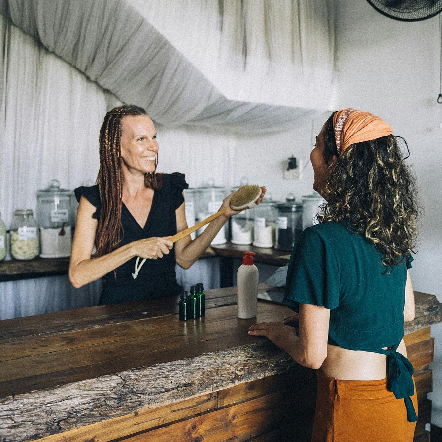 shop owner helping customer